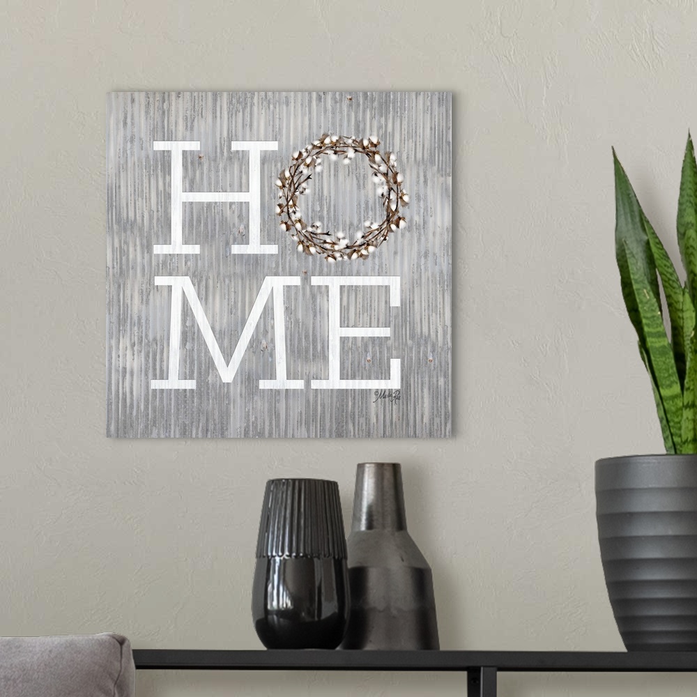 A modern room featuring "Home" with a wreath on a weathered metal background.