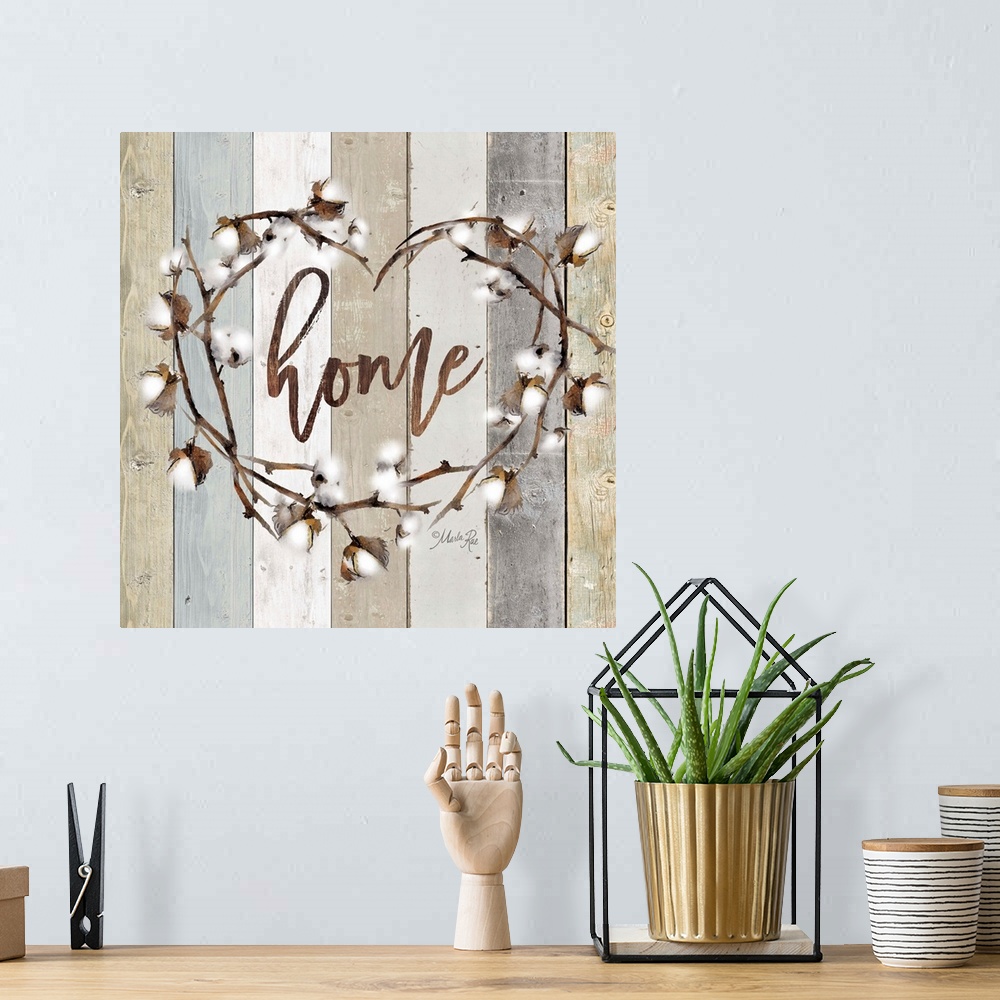 A bohemian room featuring "Home" in the middle of a heart wreath of cotton against a shiplap background.