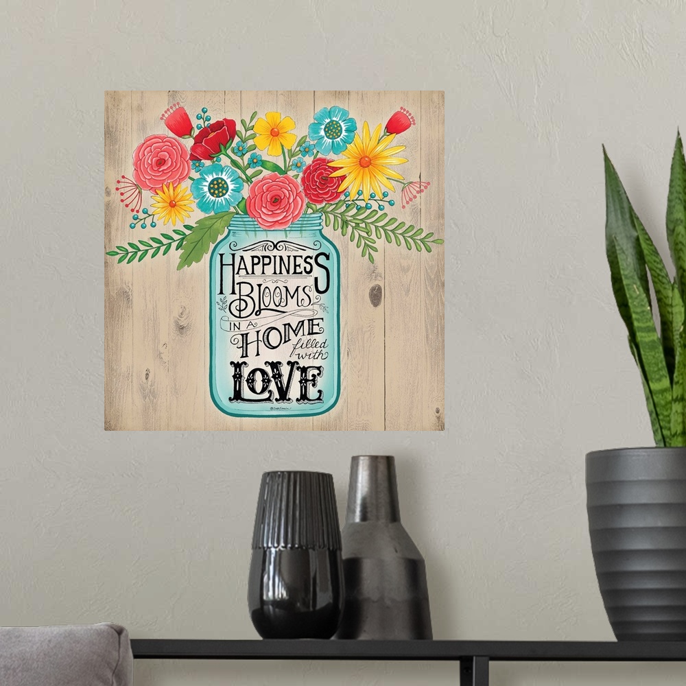 A modern room featuring A bouquet of colorful flowers in a mason jar with decorative lettering.