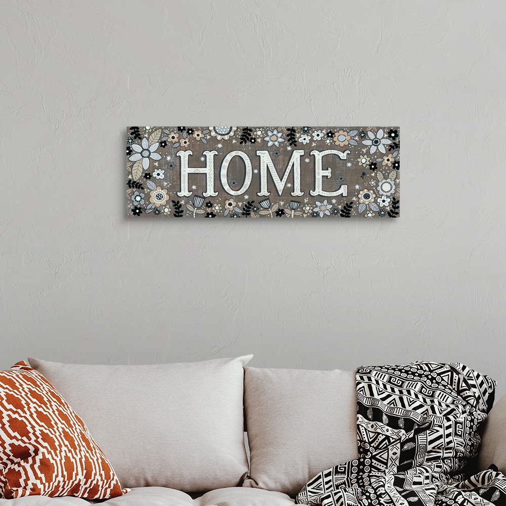 A bohemian room featuring Folk art style sign decorated with a variety of flowers.