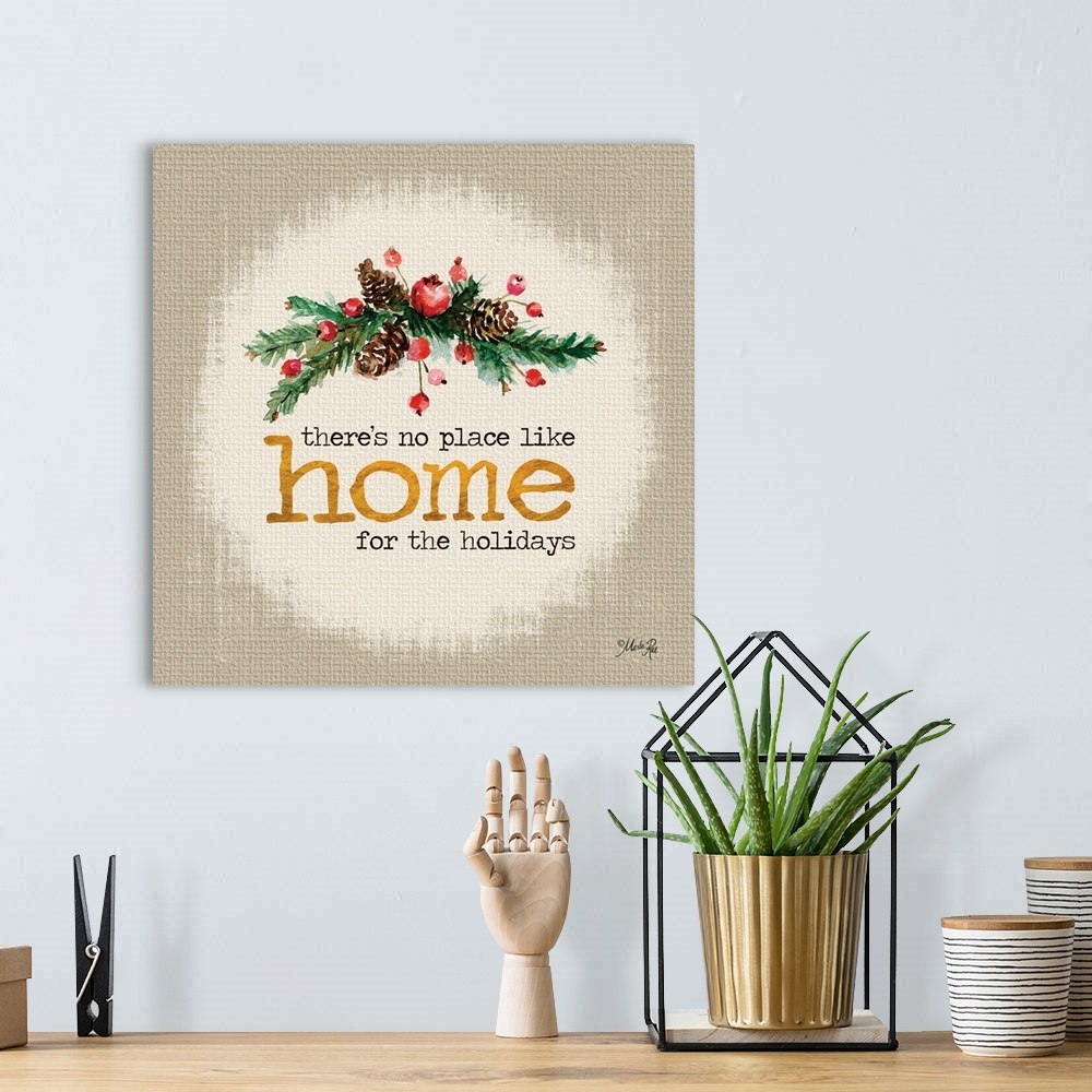 A bohemian room featuring Christmas themed artwork decorated with holly berries and pine branches with gold text.