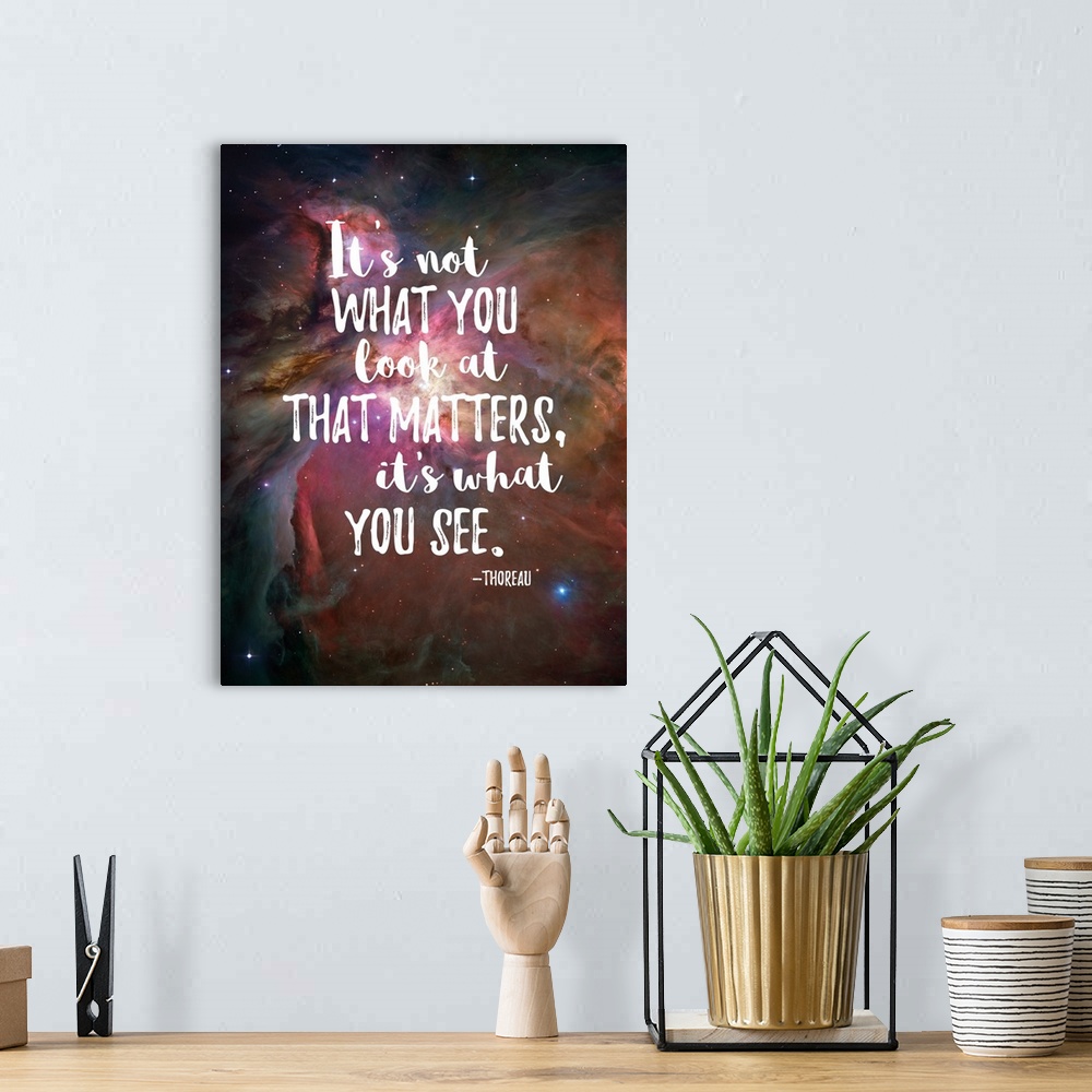 A bohemian room featuring Handlettered inspirational sentiment over an image of a nebula in space.