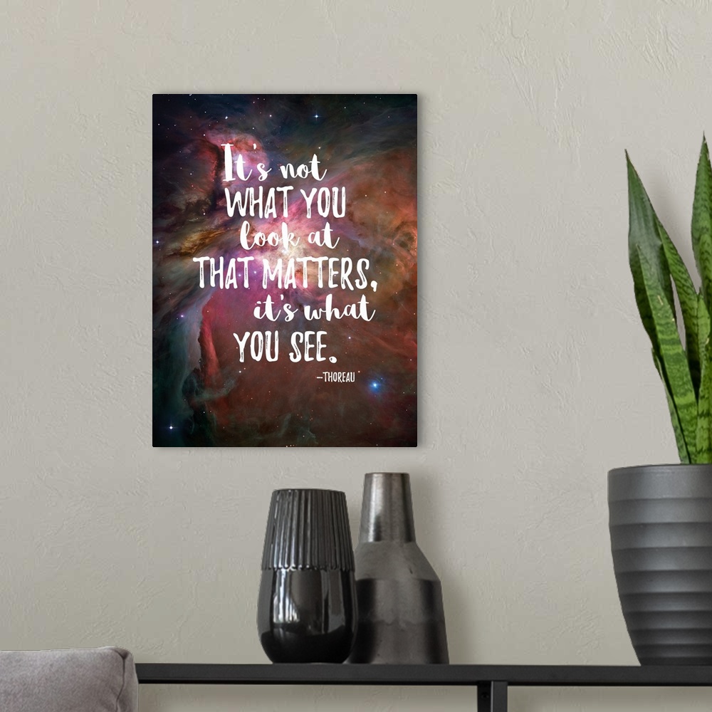 A modern room featuring Handlettered inspirational sentiment over an image of a nebula in space.