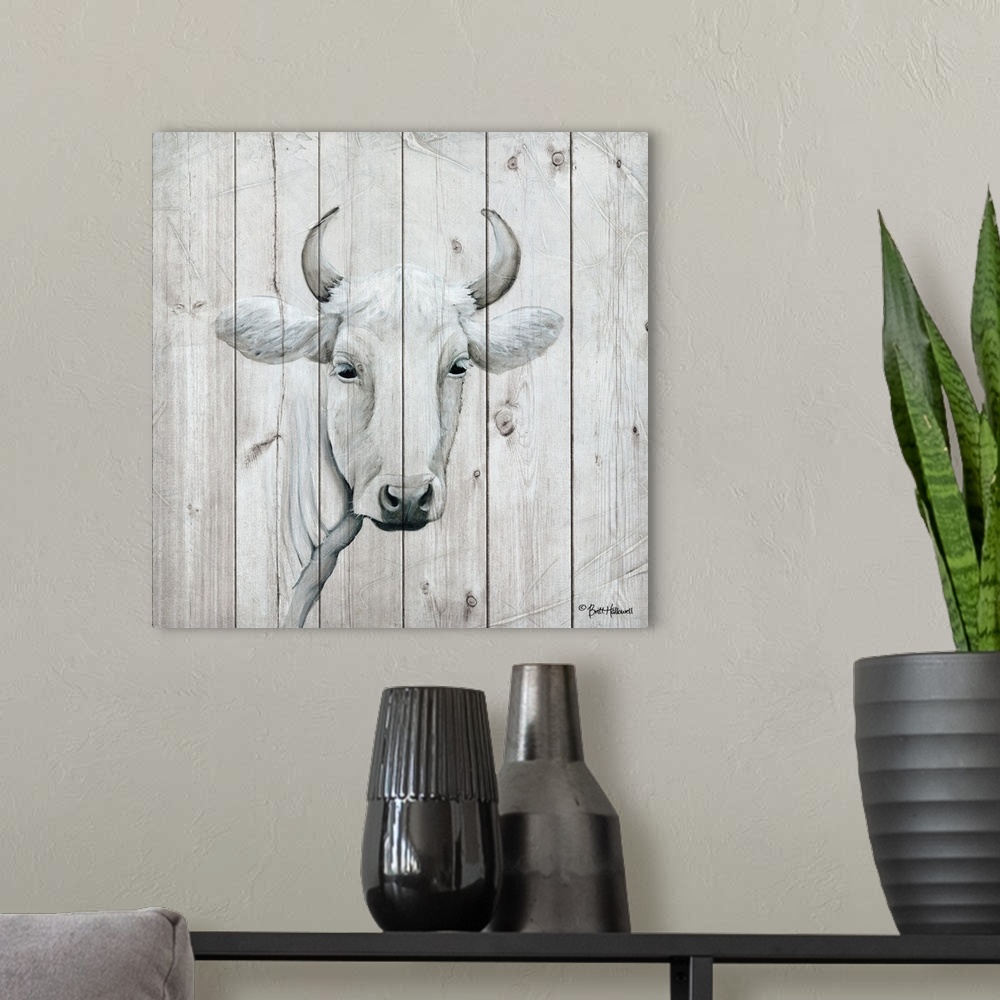 A modern room featuring Painting of a white cow with a quiet expression on a faux wooden board background.