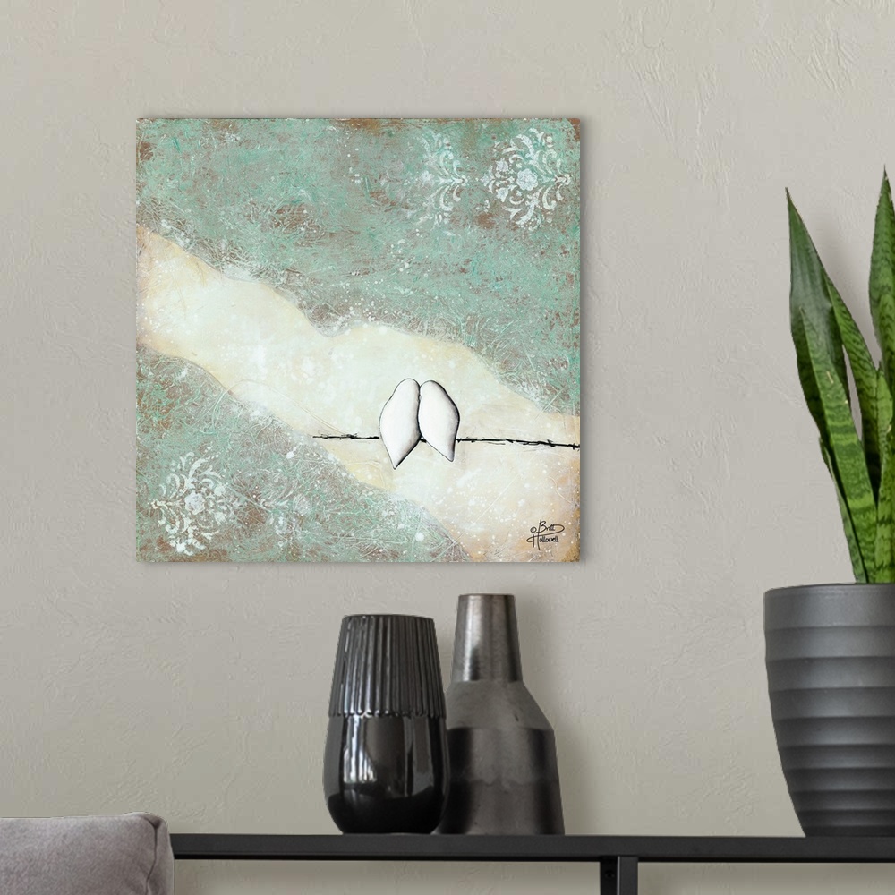 A modern room featuring Contemporary artwork of two white birds nestled together on a branch.