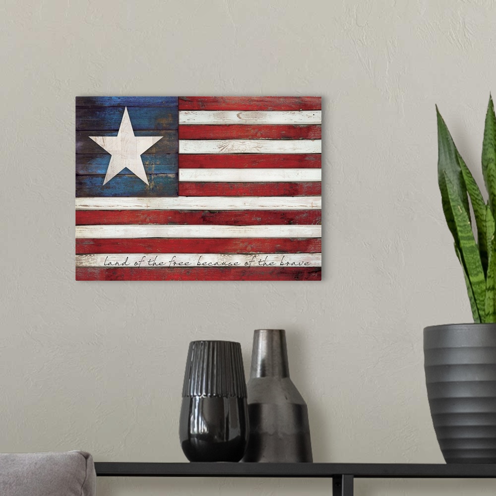 A modern room featuring Rustic distressed American flag with text in the white stripes painted on a wooden surface.