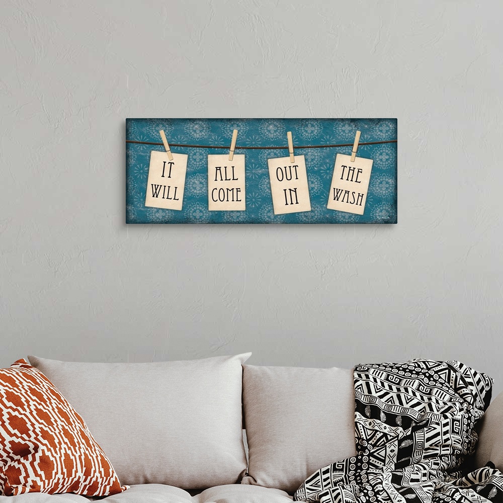 A bohemian room featuring Charming laundry room art of clothespins on a line with the text "It will all come out in the wash."