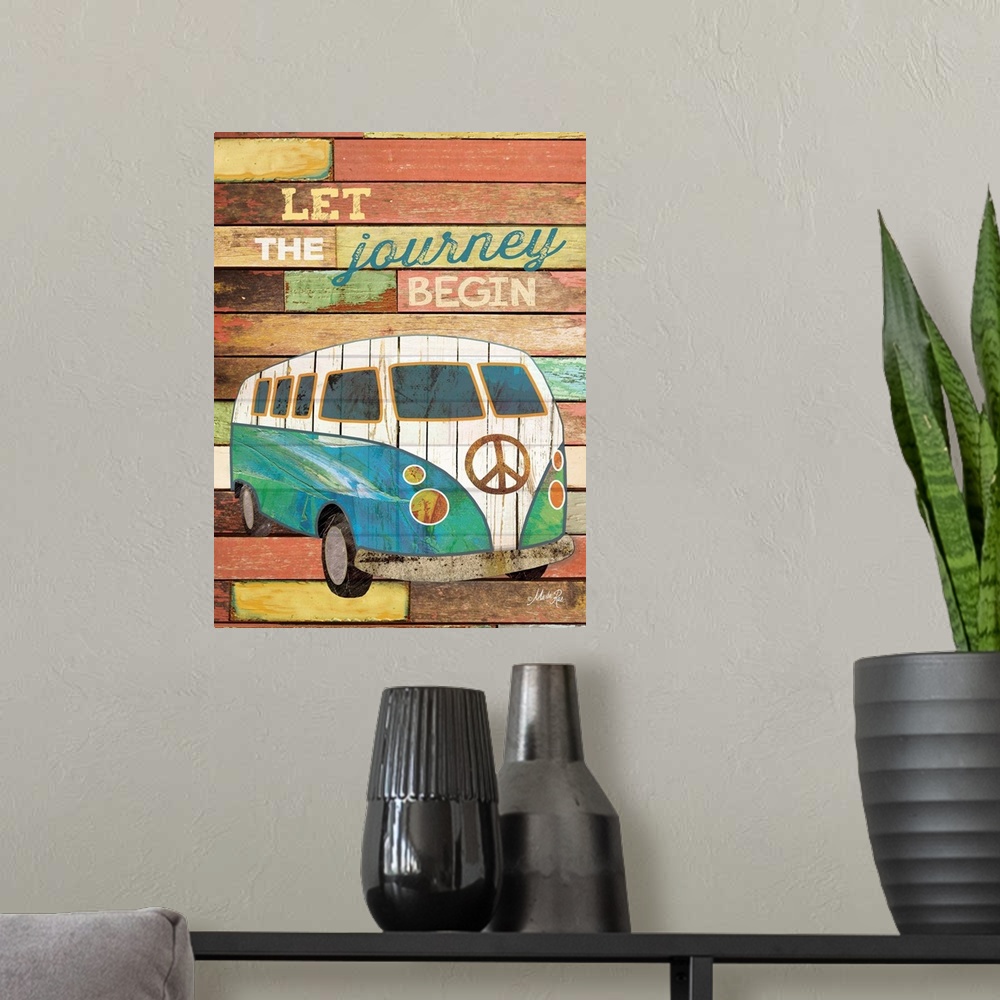 A modern room featuring Travel themed typography art with an old van against a distressed wooden surface.