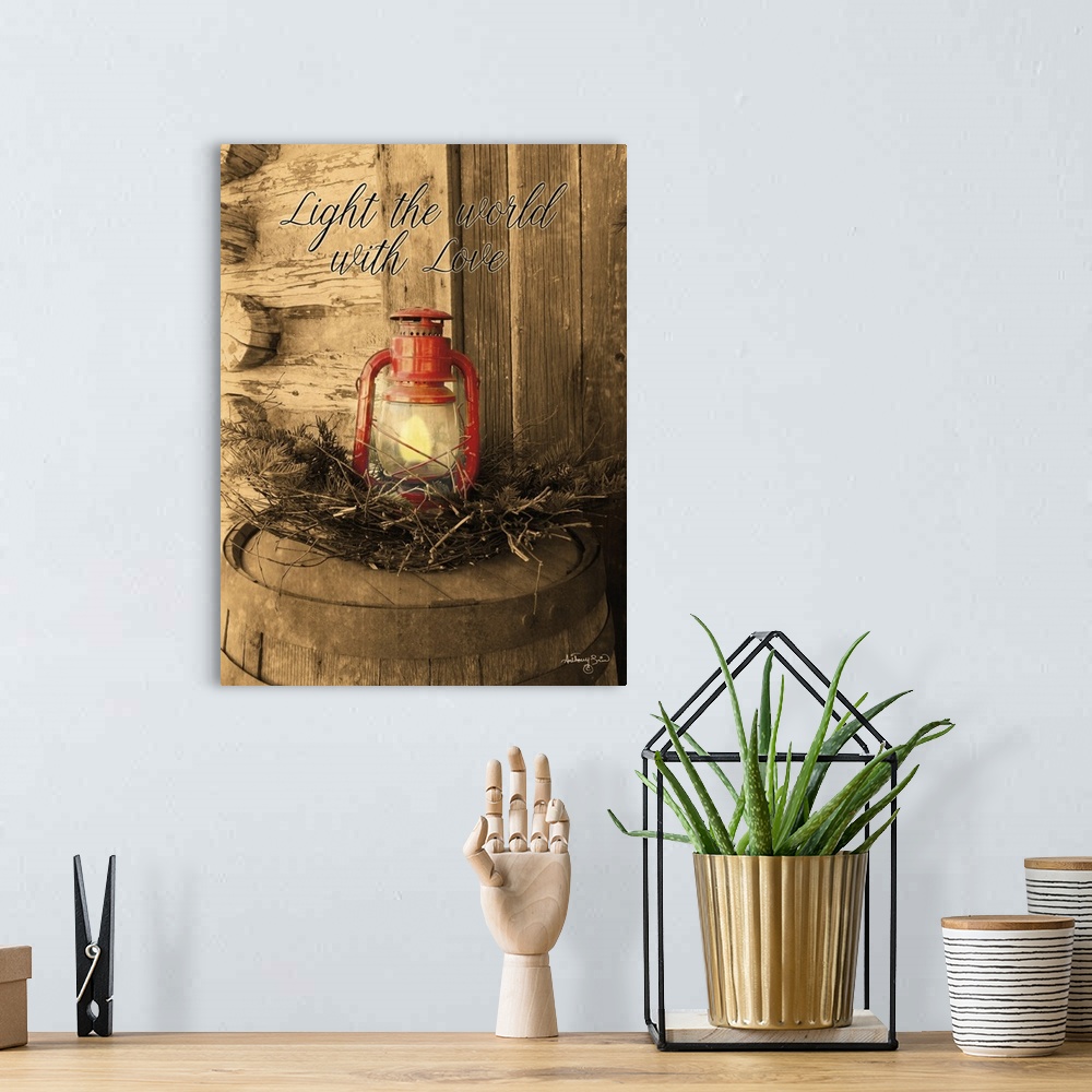 A bohemian room featuring The words: Light the world with love, are placed over a red lantern against desaturated background.