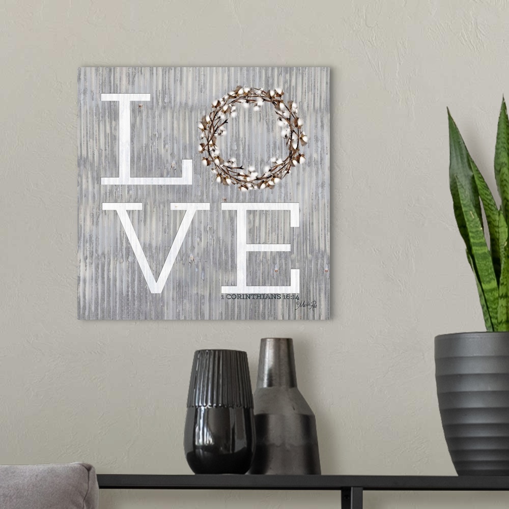 A modern room featuring "Love" with a wreath on a weathered metal background.