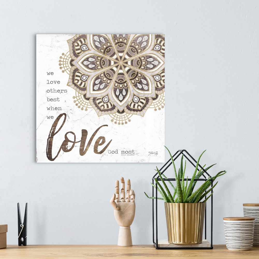 A bohemian room featuring Religious sentiment with the word "Love" in large script and a mandala design.