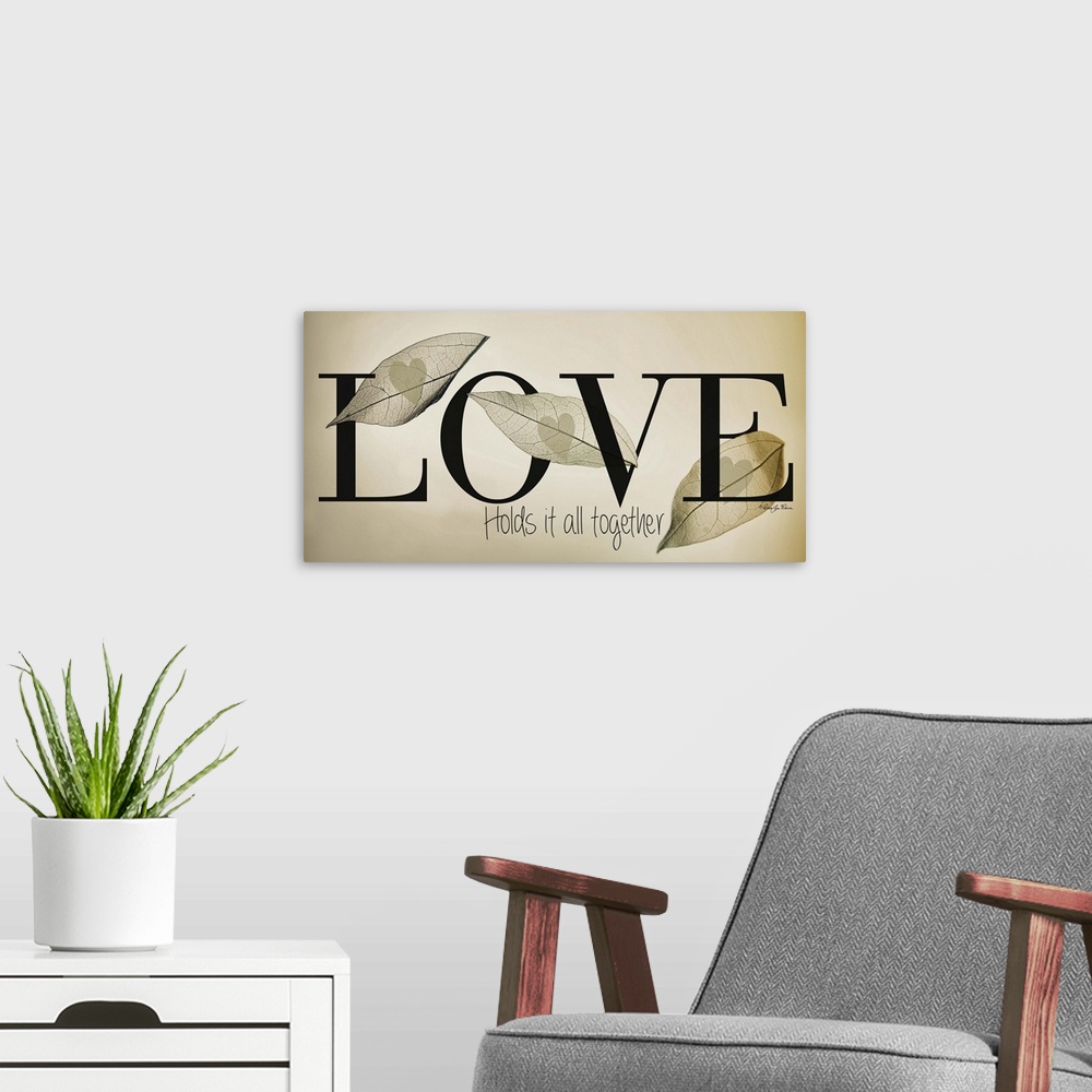 A modern room featuring Romantic typography art with a leaf design on neutral colors.