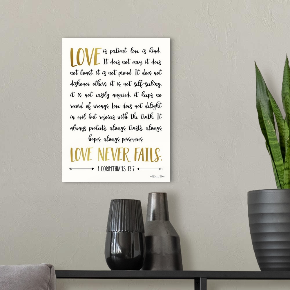A modern room featuring Bible verse 1 Corinthians 13:7 in black and gold script on white.