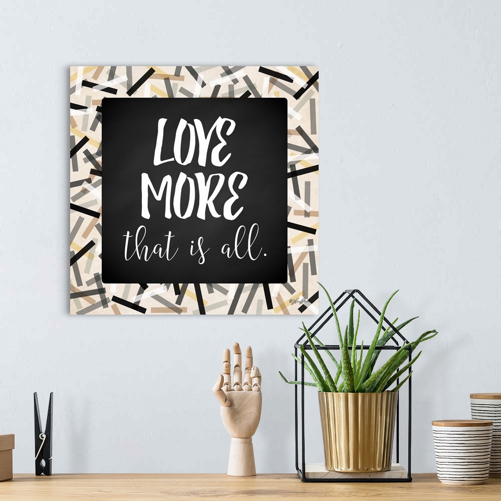 A bohemian room featuring Inspirational typography art in black and white with a festive frame.