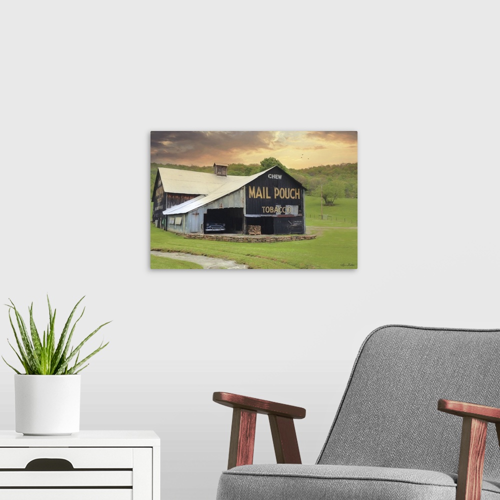 A modern room featuring Photograph of a worn building on a countryside landscape.