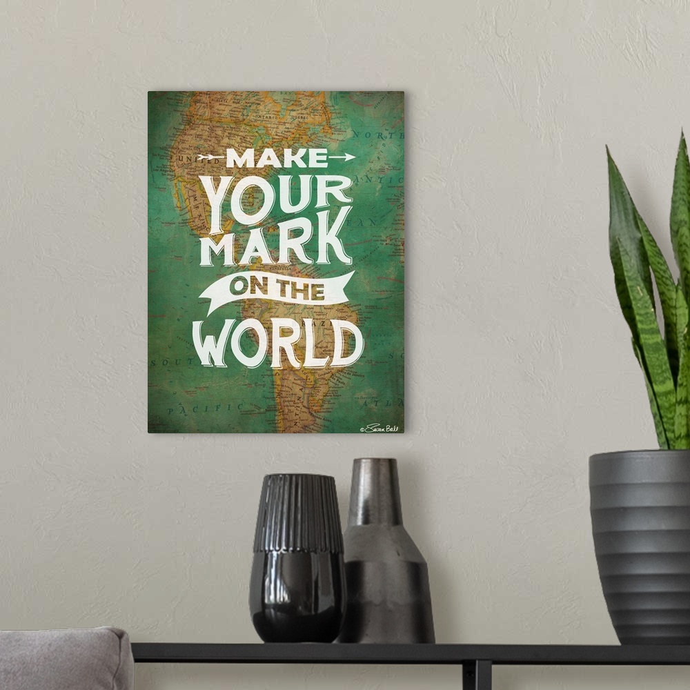 A modern room featuring Inspirational quote in white lettering against a photograph of a world map.