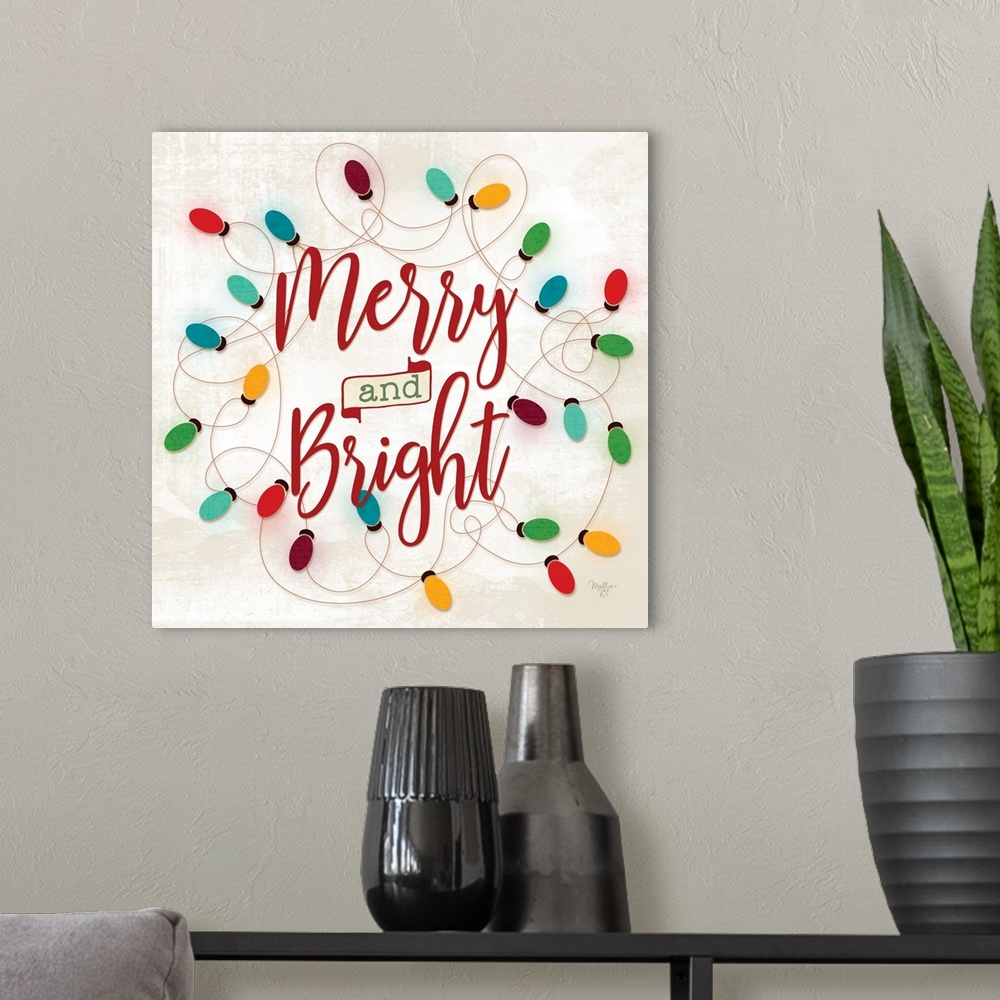 A modern room featuring Decorative artwork with festive string lights surrounding the words: Merry and Bright.
