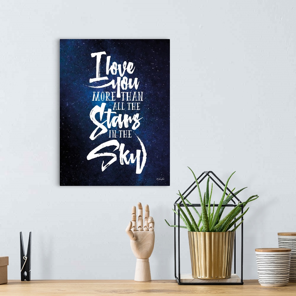 A bohemian room featuring Handlettered artwork reading "I love you more than all the stars in the sky" over an image of a s...