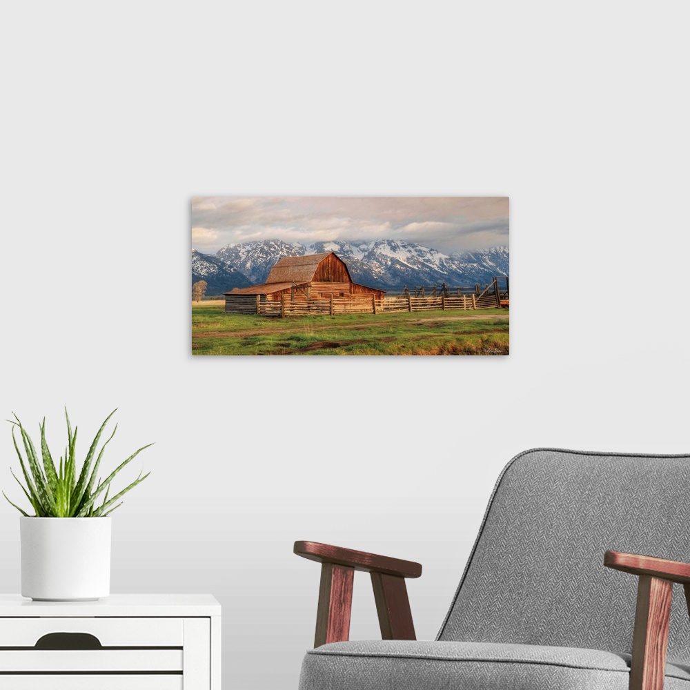A modern room featuring The famous Mormon Barn in Wyoming at the base of the Grand Teton Mountains.