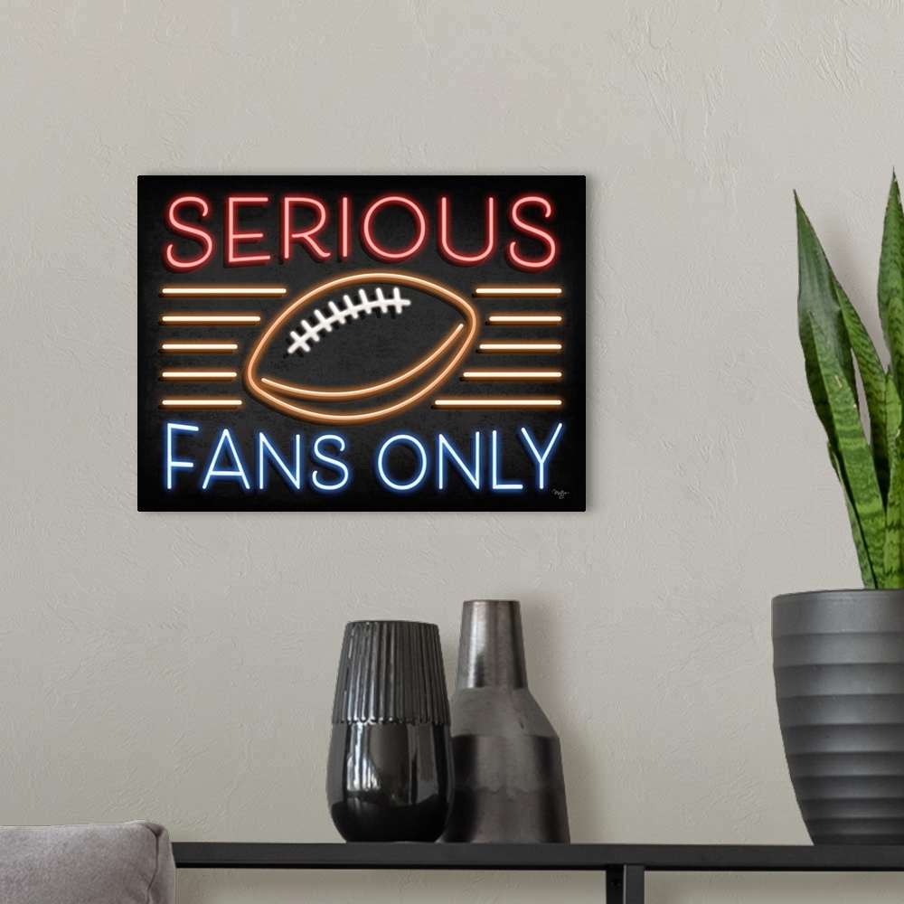 A modern room featuring Retro sign resembling neon lights which reads "Serious Fans Only."