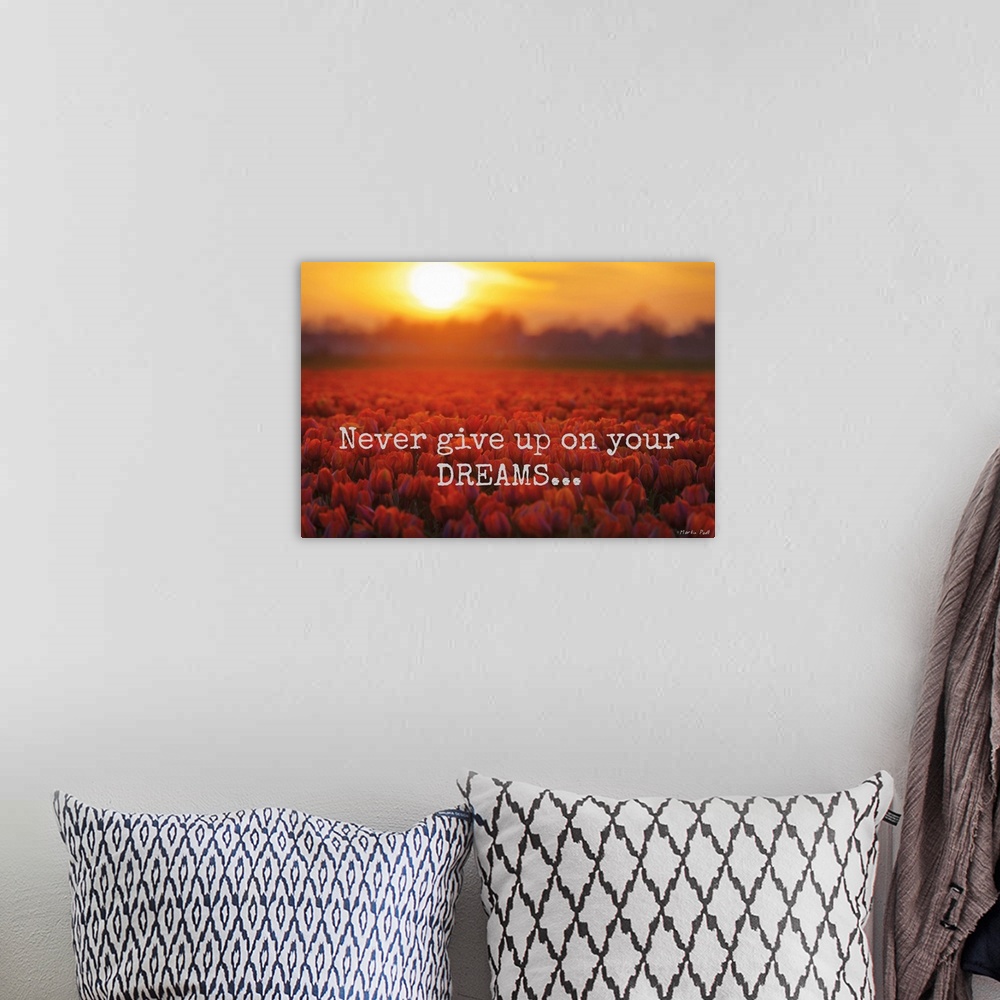 A bohemian room featuring Fields of red tulips under fiery sunset clouds, with inspirational text.