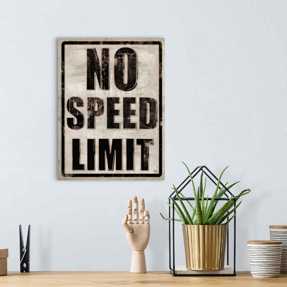 A bohemian room featuring No Speed Limit traffic sign with a weathered effect.