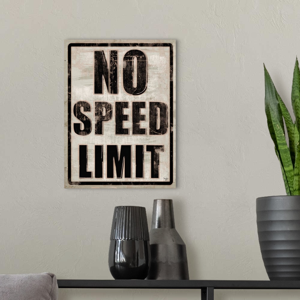 A modern room featuring No Speed Limit traffic sign with a weathered effect.