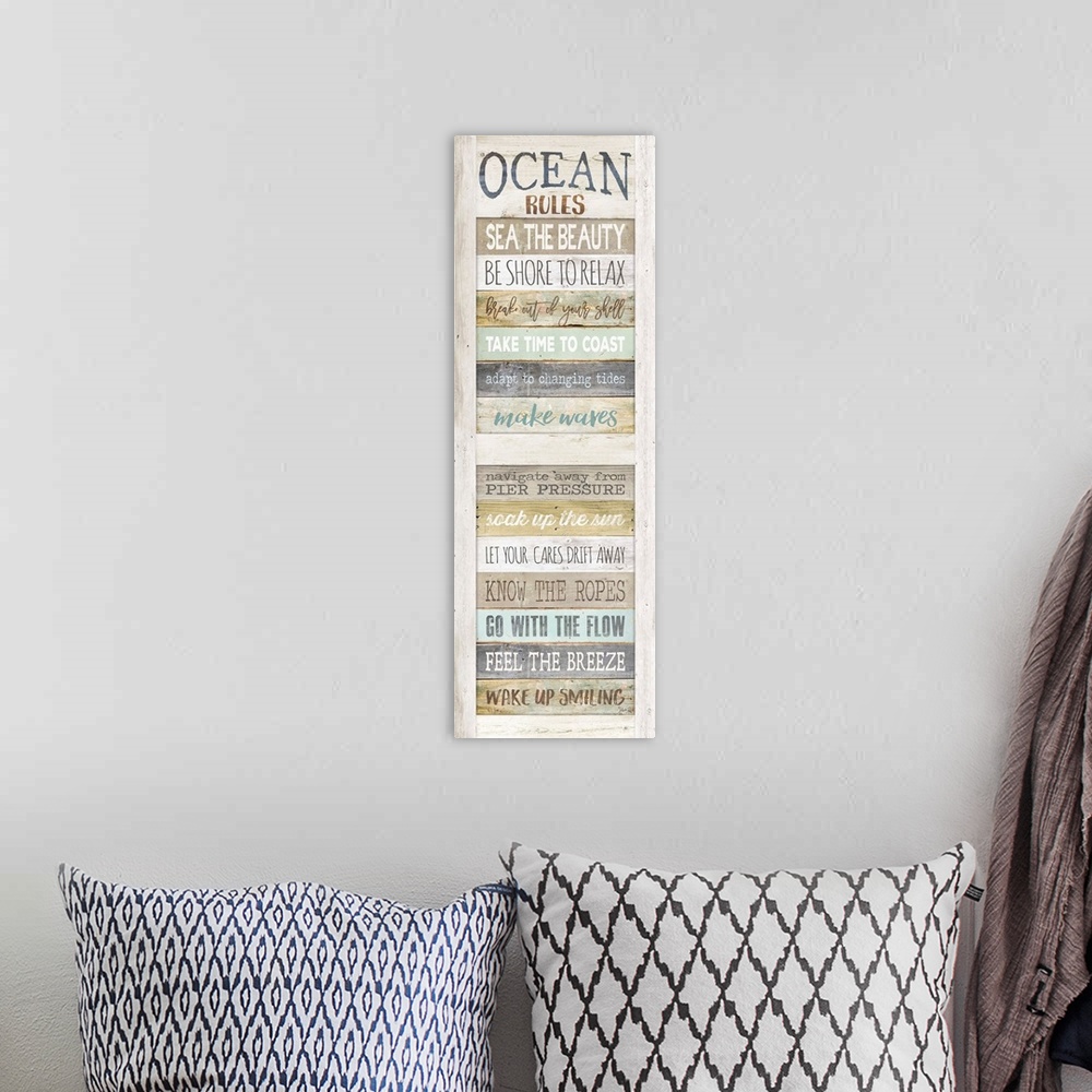A bohemian room featuring List of rules for enjoying the seaside painted on a wooden board background.