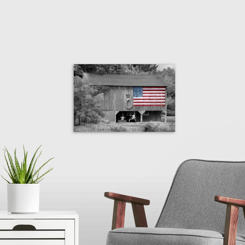 A modern room featuring Black and white photo of a barn with an American Flag in color painted on the side.
