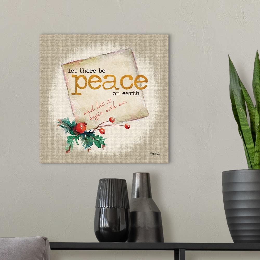 A modern room featuring Christmas themed artwork decorated with holly berries and pine branches with gold text.