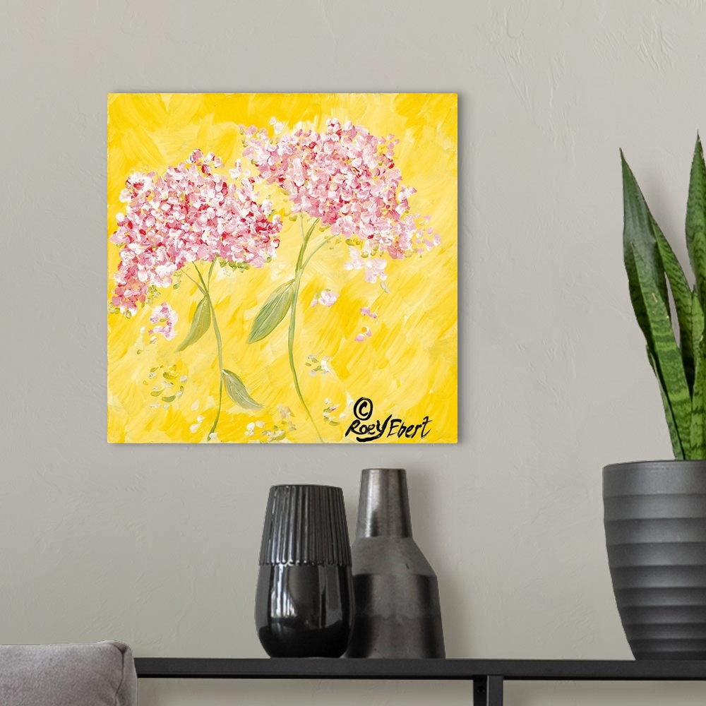 A modern room featuring Square contemporary painting of Pink Hydrangeas against a bright yellow background.