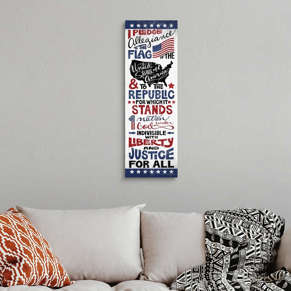 A bohemian room featuring Handlettered artwork of the Pledge of Allegiance in red, white, and blue, on a textured background.