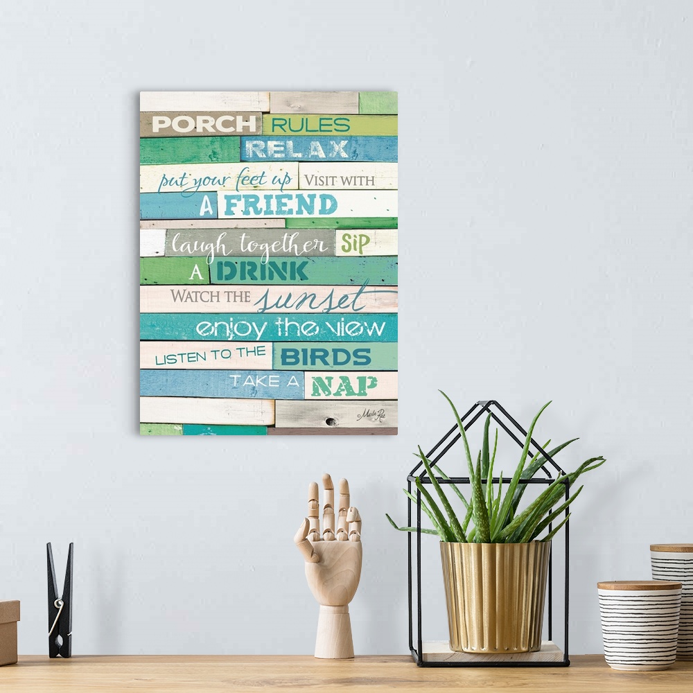 A bohemian room featuring Porch rules typography art against a rustic wooden surface.