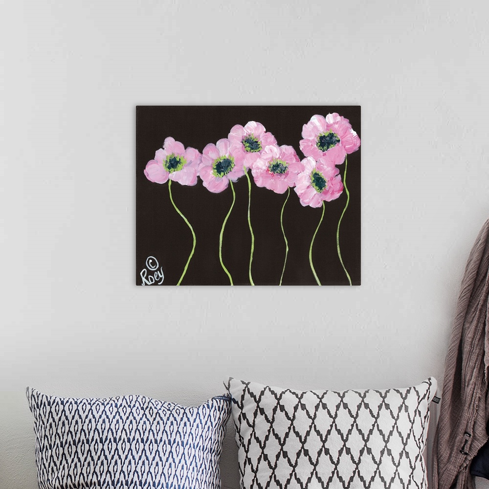 A bohemian room featuring Contemporary artwork of pink posies on a black background.