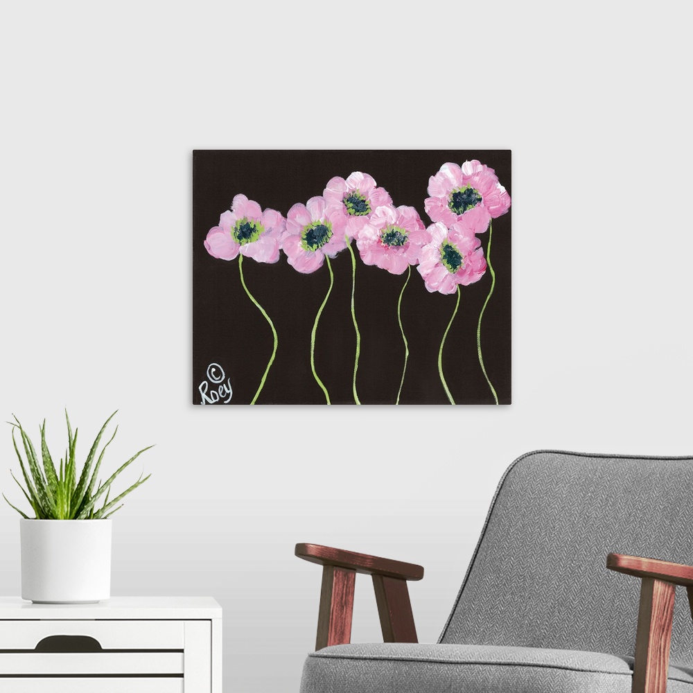 A modern room featuring Contemporary artwork of pink posies on a black background.