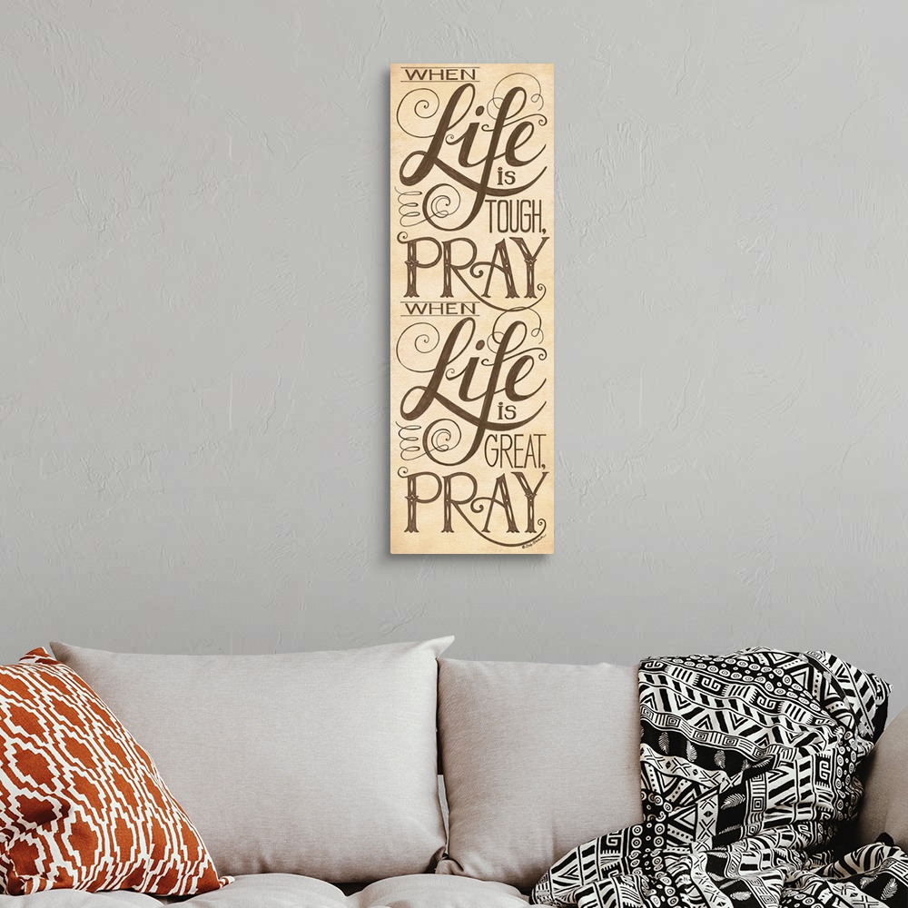 A bohemian room featuring Handlettered home decor art with black  lettering against a distressed brown background.