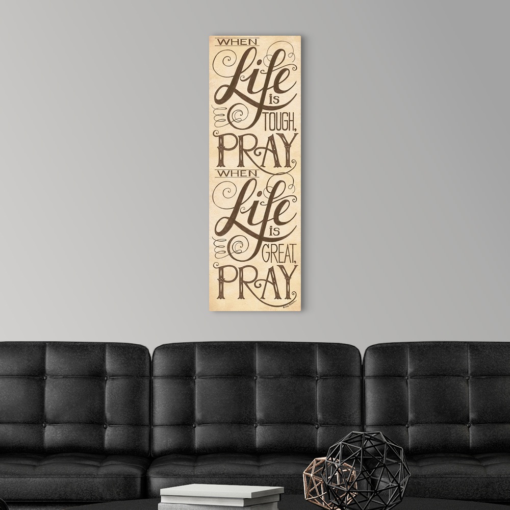A modern room featuring Handlettered home decor art with black  lettering against a distressed brown background.
