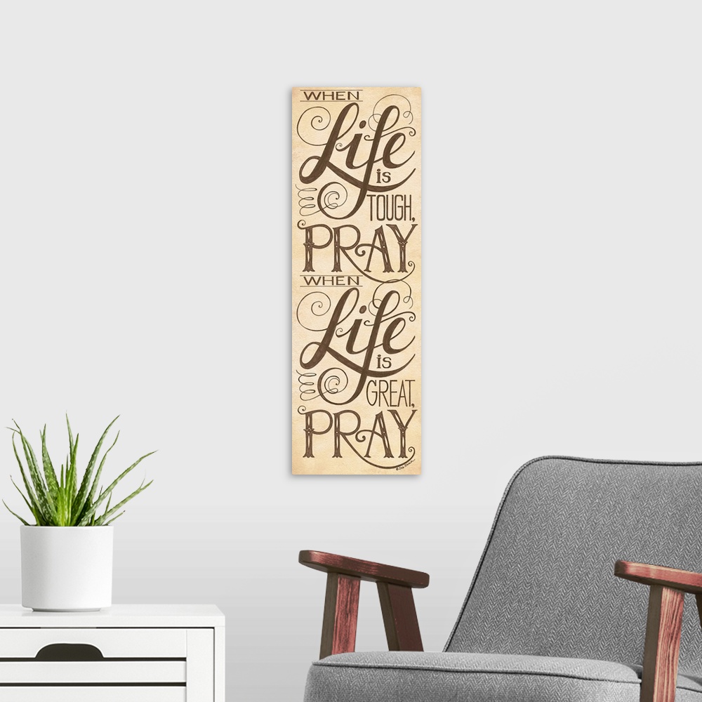 A modern room featuring Handlettered home decor art with black  lettering against a distressed brown background.