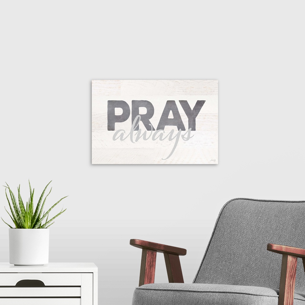 A modern room featuring Pray Always