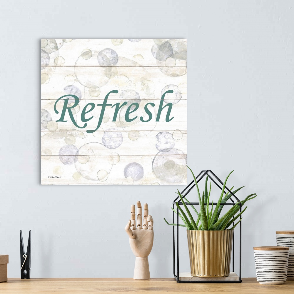 A bohemian room featuring The word "Refresh" surrounded by bubbles on a light background with a wooden effect.