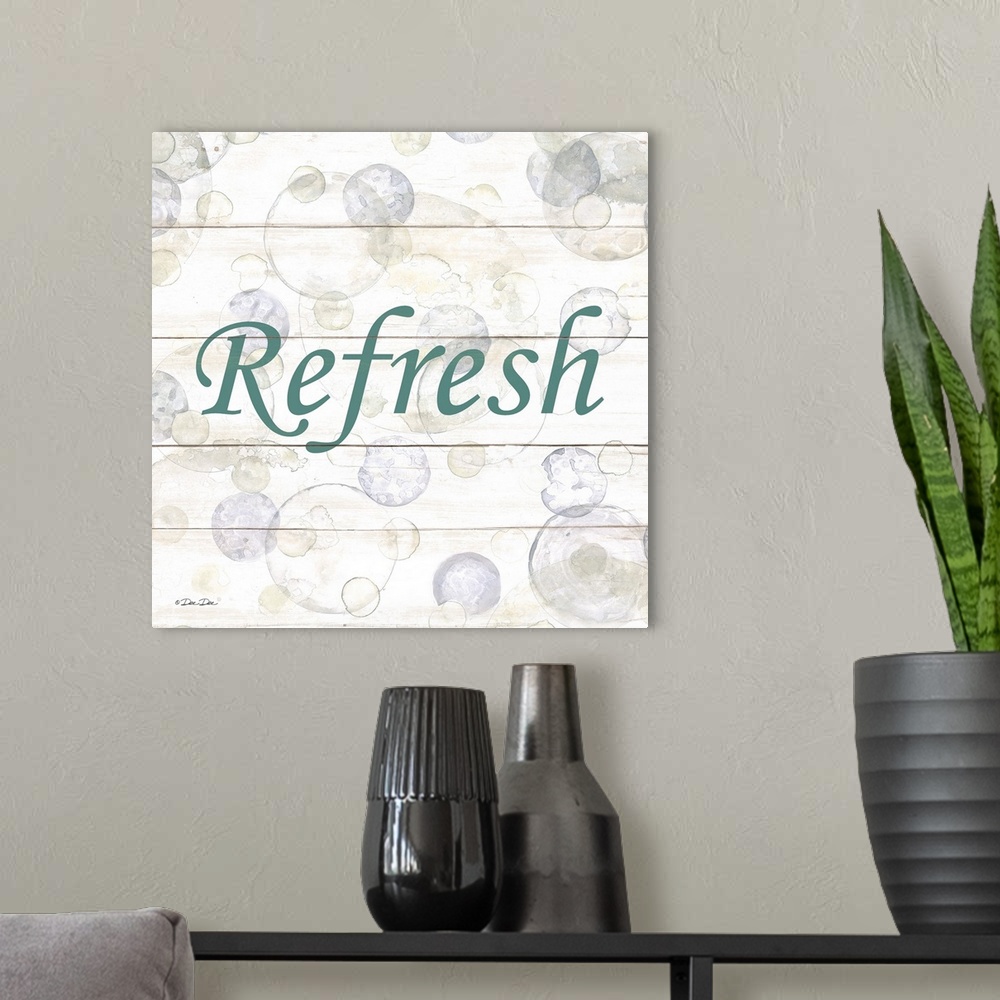 A modern room featuring The word "Refresh" surrounded by bubbles on a light background with a wooden effect.