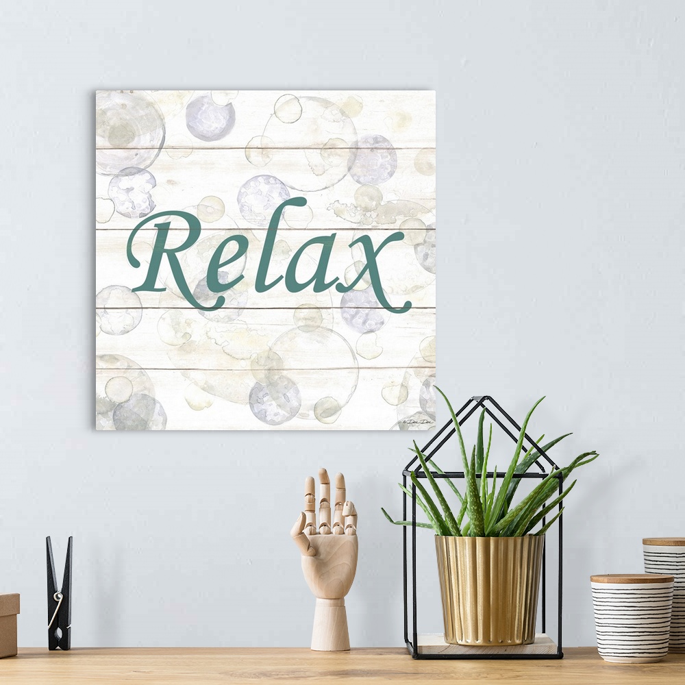 A bohemian room featuring The word "Relax" surrounded by bubbles on a light background with a wooden effect.