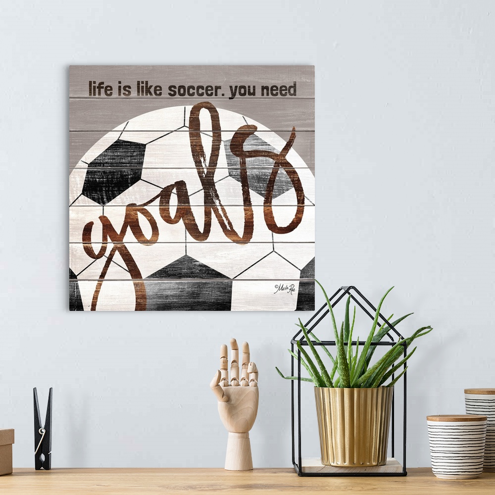 A bohemian room featuring Soccer themed typography art on a wooden board background.