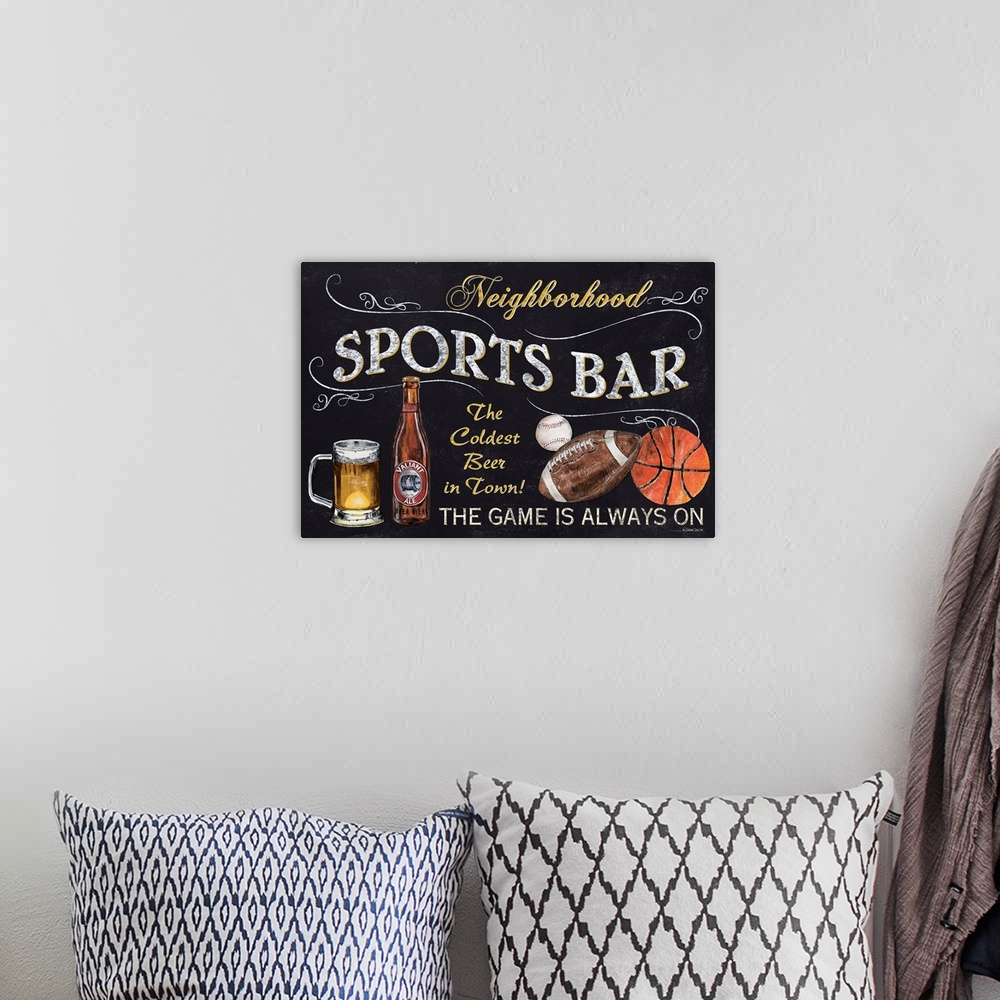 A bohemian room featuring A chalkboard style sign with beer, a football, and basketball.