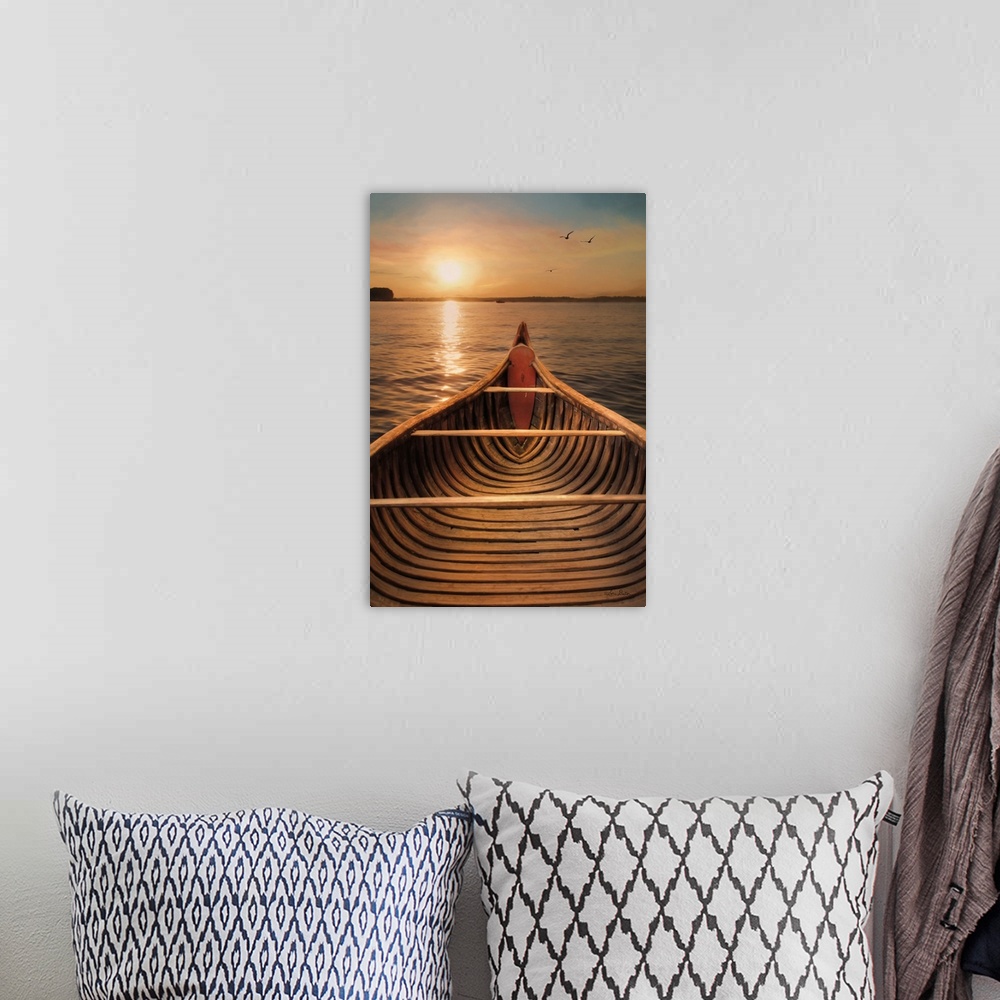 A bohemian room featuring View from inside a canoe on a lake with the sun setting on the horizon.