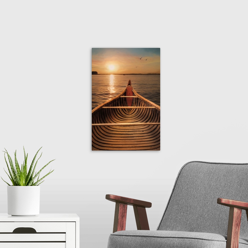 A modern room featuring View from inside a canoe on a lake with the sun setting on the horizon.