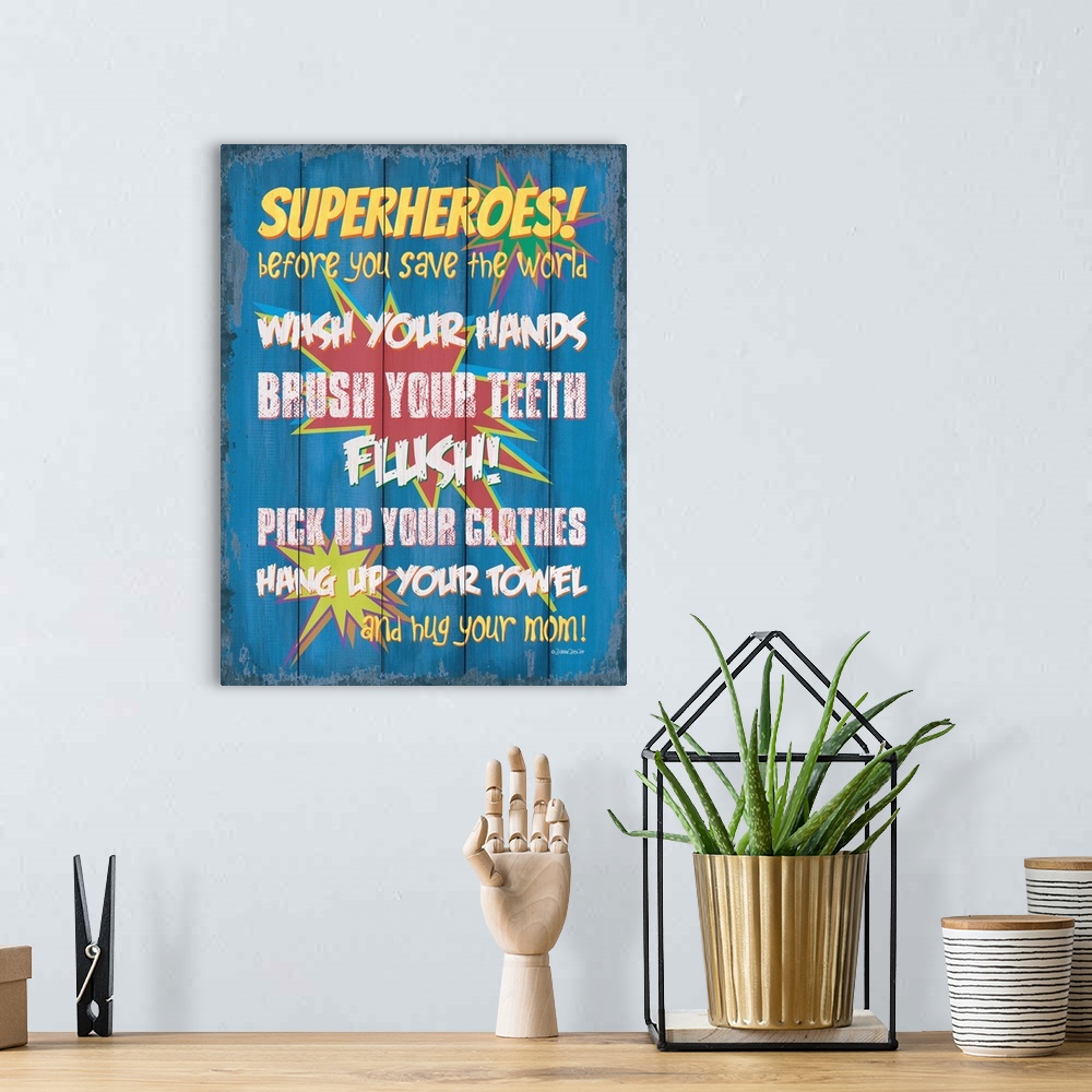 A bohemian room featuring Kids' typography art with a comic superhero theme, encouraging proper bathroom habits.