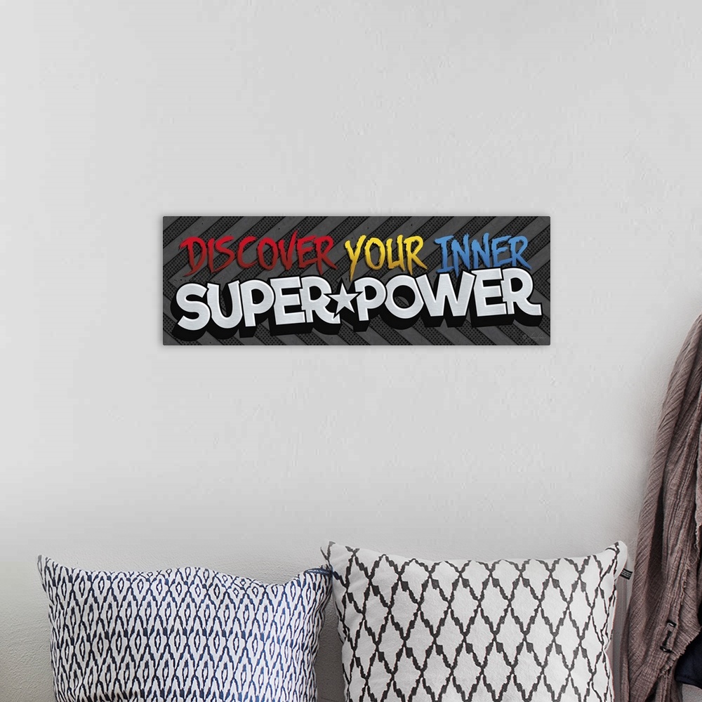 A bohemian room featuring Typography art reading "Discover your inner superpower" in exciting, bold lettering on a striped ...