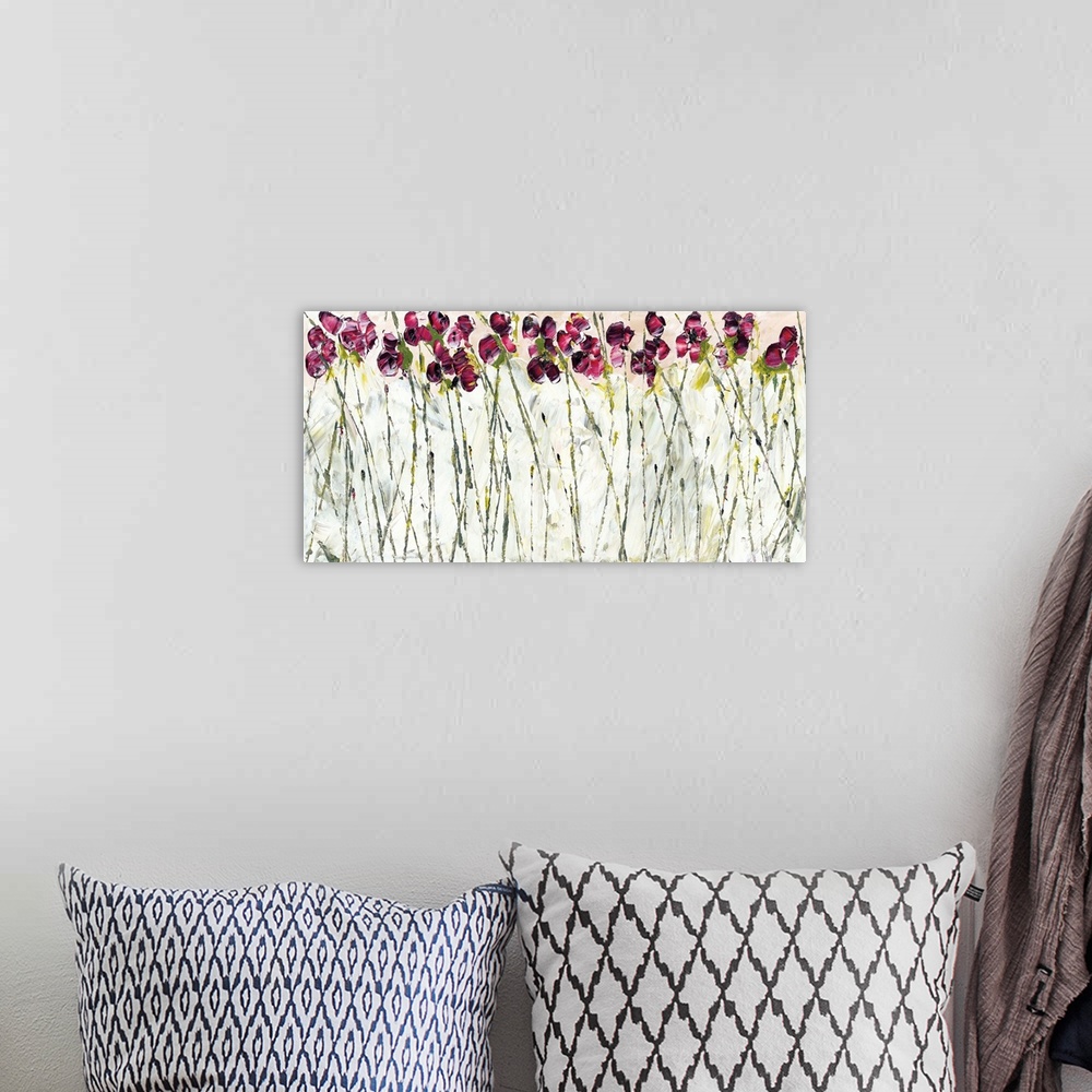 A bohemian room featuring Contemporary art print of magenta colored sweet pea flowers with tall thin stems.
