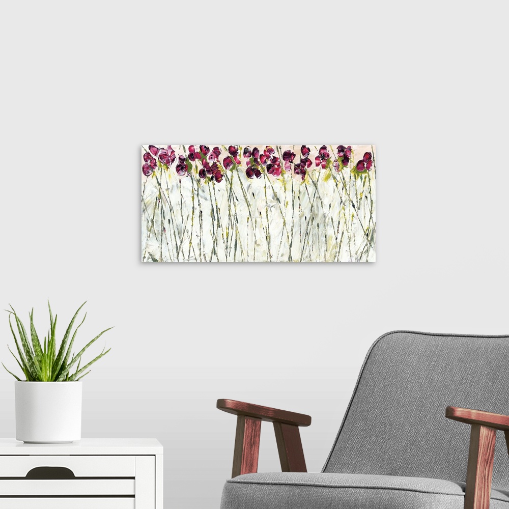 A modern room featuring Contemporary art print of magenta colored sweet pea flowers with tall thin stems.